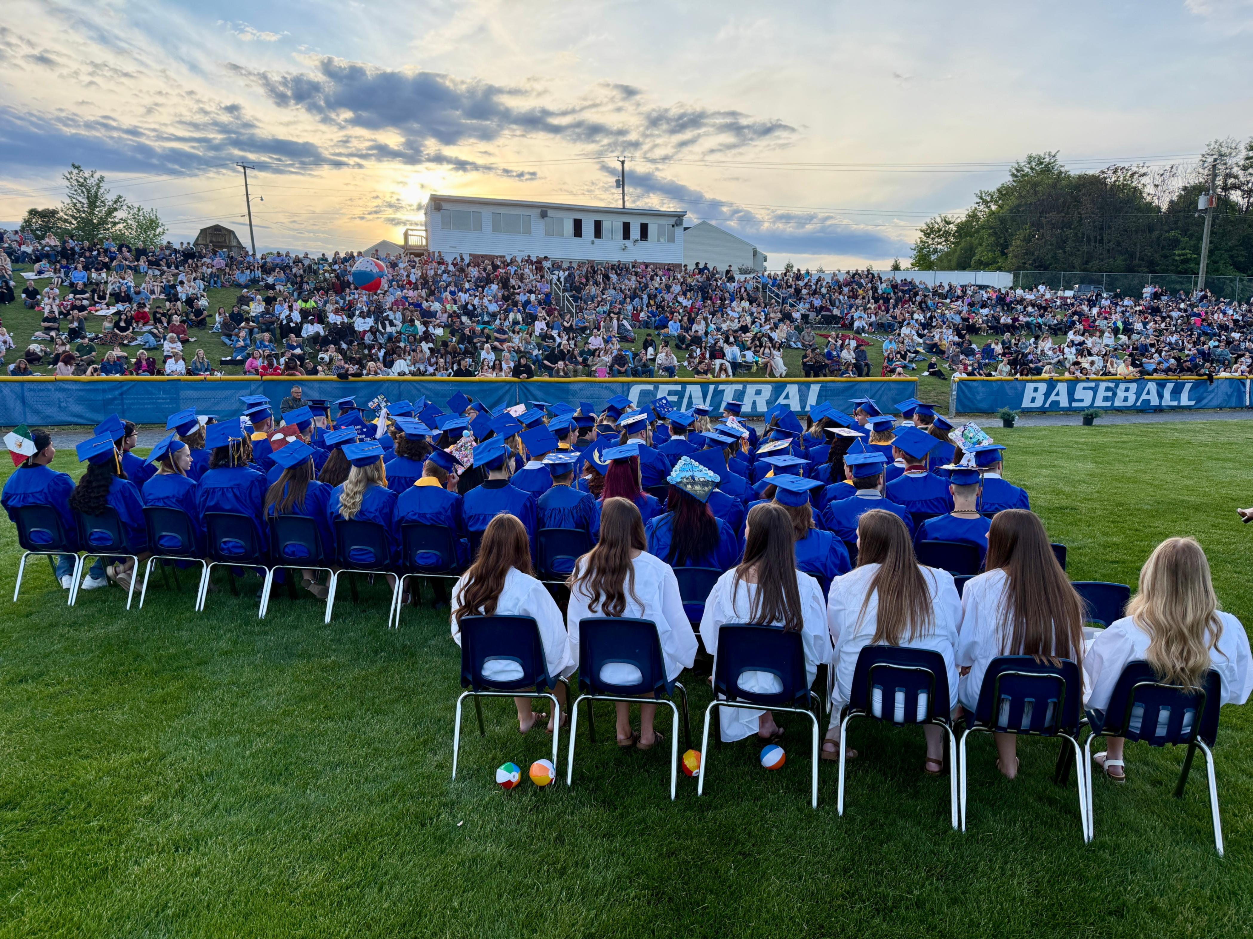 Central Senior Graduate Under a Picturesque Sky